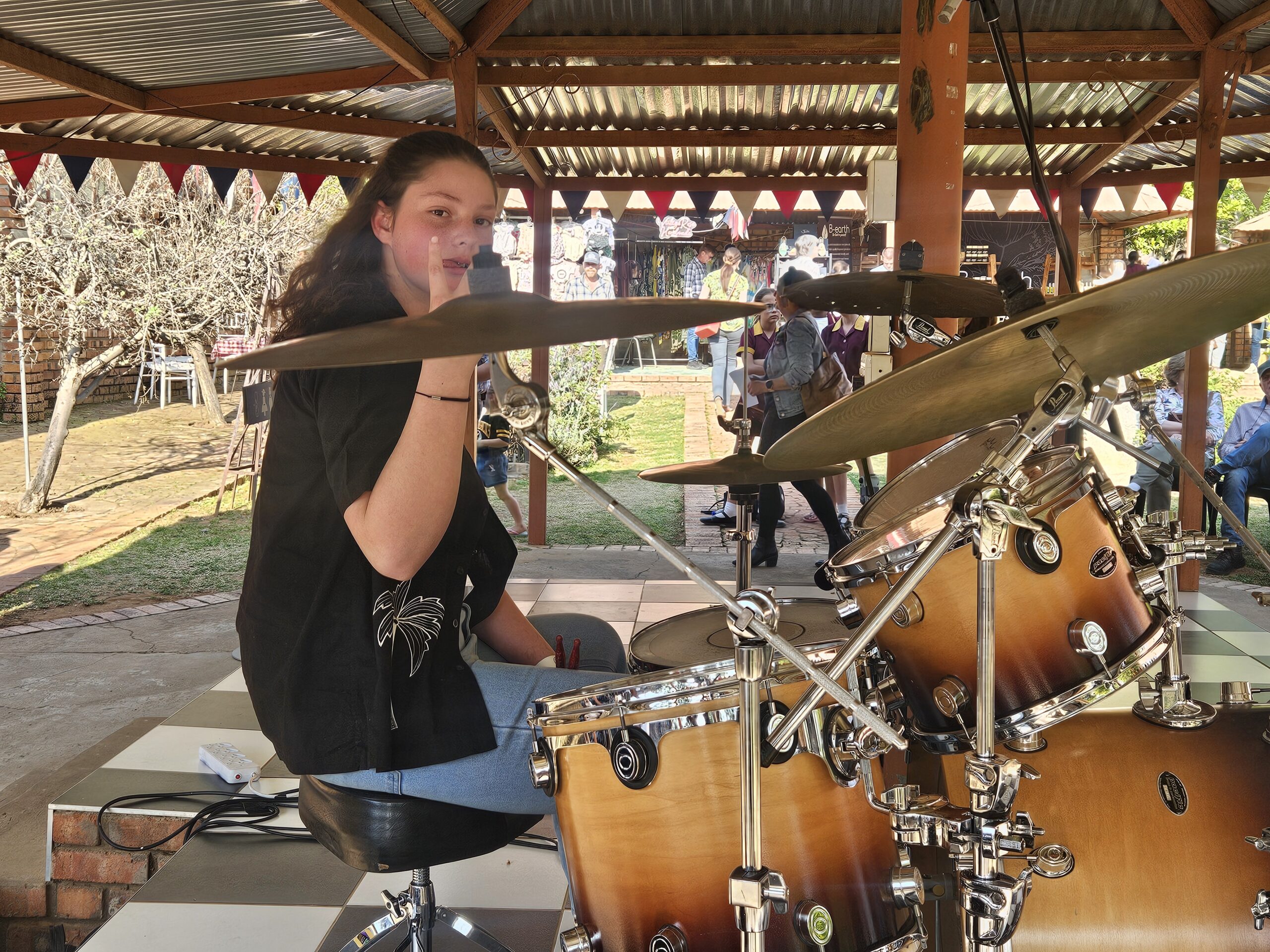 Teenage student drummer performing outdoors